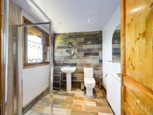 a bathroom with a sink and a toilet at Chalet Montvalezan-La Rosière, 9 pièces, 14 personnes - FR-1-398-647 in Montvalezan