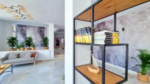 a living room with a black book shelf at Mojo Resort in Eforie Sud