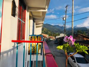 a balcony of a building with a colorful window at Salento_littlehouse in Salento