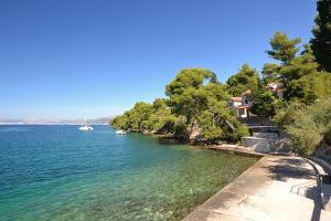 a view of a body of water with boats in it at Apartments with parking space Splitska, Brac - 15197 in Splitska