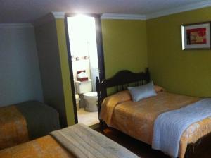 Postel nebo postele na pokoji v ubytování Hotel Margarita 2