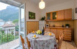 a kitchen with a table with fruit on it at Nice Apartment In Avio With Wifi in Avio