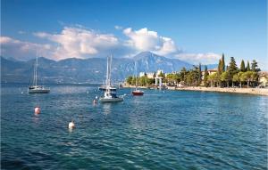 a group of boats in a large body of water at Nice Apartment In Avio With Wifi in Avio