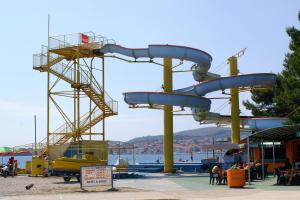a water park with a slide on the beach at Apartments with parking space Vodice - 927 in Vodice