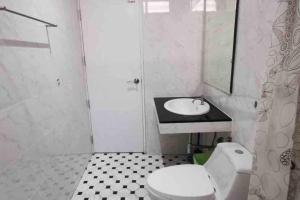 a bathroom with a white toilet and a sink at 8FINITE House in Bang Su +27 photos