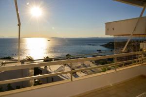 a view of the ocean from the balcony of a condo at Anavissos Panoramic sea view apt with shared pool in Anavyssos