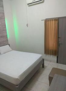 Cama o camas de una habitación en HOTEL MAYA