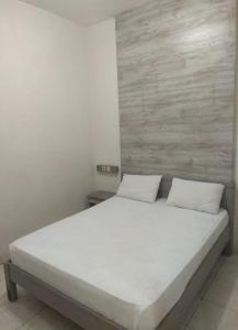 Cama o camas de una habitación en HOTEL MAYA