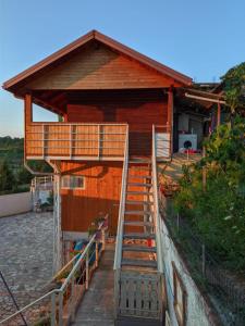 a house with stairs leading up to a building at Vila Livio - Guest house Rreshen Mirdite in Rrëshen