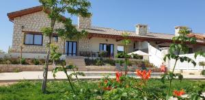 a house with a garden in front of it at STAY Chrystallia Holiday Villa in Anarita