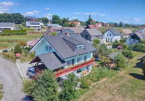 an aerial view of a residential neighborhood with houses at ITSOFT smart apartment in Komenda