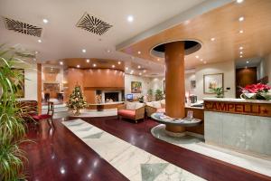 a lobby of a hotel with a reception desk at Hotel Campelli in Sondrio