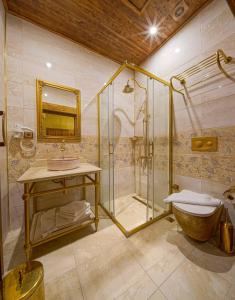 a bathroom with a shower and a sink at Le Reve Butik Otel in Hatay