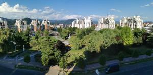 an aerial view of a city with tall buildings at Mara Park in Baia Mare