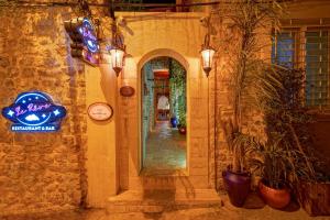 a hallway of a house with a mirror and lights at Le Reve Butik Otel in Hatay