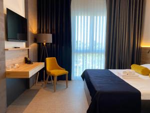 Postelja oz. postelje v sobi nastanitve Hotel Leonardo