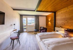 Postel nebo postele na pokoji v ubytování BOUTIQUEHOTEL das edelweiss