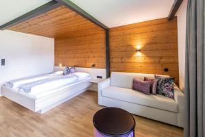 Postel nebo postele na pokoji v ubytování BOUTIQUEHOTEL das edelweiss