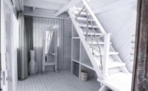 a stair case in a room with a ladder at Gravity Eco Boutique Hotel - Adults Only in Uluwatu