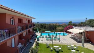 a view of a hotel with a swimming pool at Paradise Studios in Svoronata