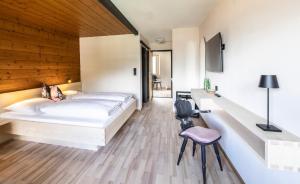 Postel nebo postele na pokoji v ubytování BOUTIQUEHOTEL das edelweiss