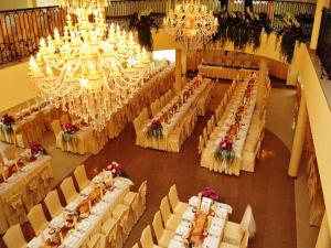 an overhead view of a banquet hall with tables and chandeliers at Hotel Sevilla in Rawa Mazowiecka