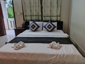 Postel nebo postele na pokoji v ubytování IKI IKI Guesthouse
