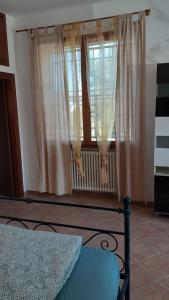 Postel nebo postele na pokoji v ubytování Ai Boschi