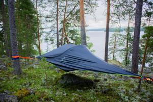 a blue tent sitting in the middle of a forest at Hideway Glamping Tree tent in Muurame