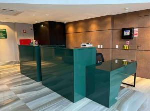 a lobby with a glass counter in a room at QS Marista - Studio Alessandra Antonelli - Flat 1708 in Goiânia