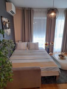 Postel nebo postele na pokoji v ubytování Calla apartment Zagreb - NOVI APARTMAN, GARAŽA, VIDEO NADZOR
