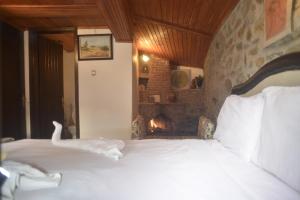 Una cama o camas en una habitación de Şirince Doğadaki Evler