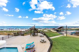 a view of the beach from the balcony of a resort at Updated Beachfront 2 BR 2 Bath Condo with direct views of the beach in Orange Beach