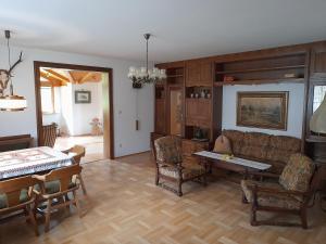 a living room with a couch and a table at Ferienhaus Reiter in Schladming