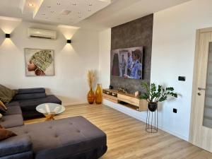 a living room with a couch and a table at Apartment Ivana in Trogir