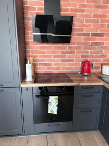 Kuchyňa alebo kuchynka v ubytovaní Apartament No. 26 Nad Iławką