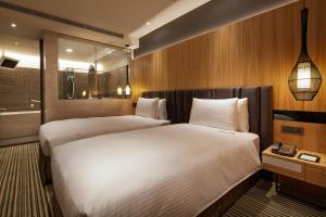 Postel nebo postele na pokoji v ubytování La Vida Hotel