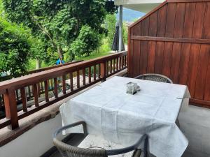 a white table and chairs on a balcony at "Bindergor-Hof" Georg Barbieri in Terlano