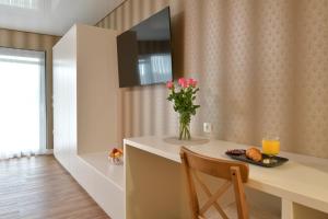 A television and/or entertainment centre at TI Hotel