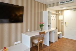 A television and/or entertainment centre at TI Hotel