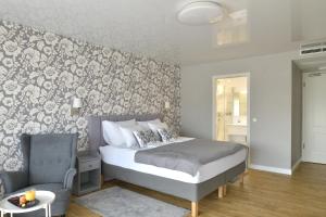 A bed or beds in a room at TI Hotel