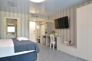A television and/or entertainment centre at TI Hotel