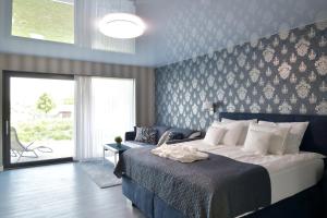 A bed or beds in a room at TI Hotel