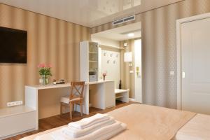 A bed or beds in a room at TI Hotel