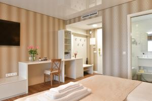 A television and/or entertainment centre at TI Hotel