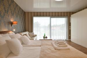 A bed or beds in a room at TI Hotel
