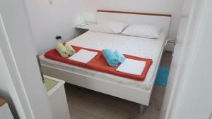 Postel nebo postele na pokoji v ubytování Apartments Orhideja