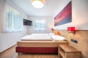 Posteľ alebo postele v izbe v ubytovaní Apartments Cesa Ploner