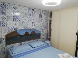 Łóżko lub łóżka w pokoju w obiekcie Il Gabbiano Blu - La Villetta