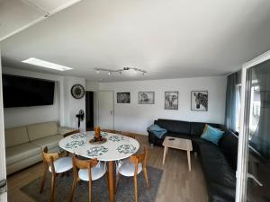 a living room with a table and a couch at Residenz am Roten Tor in Augsburg